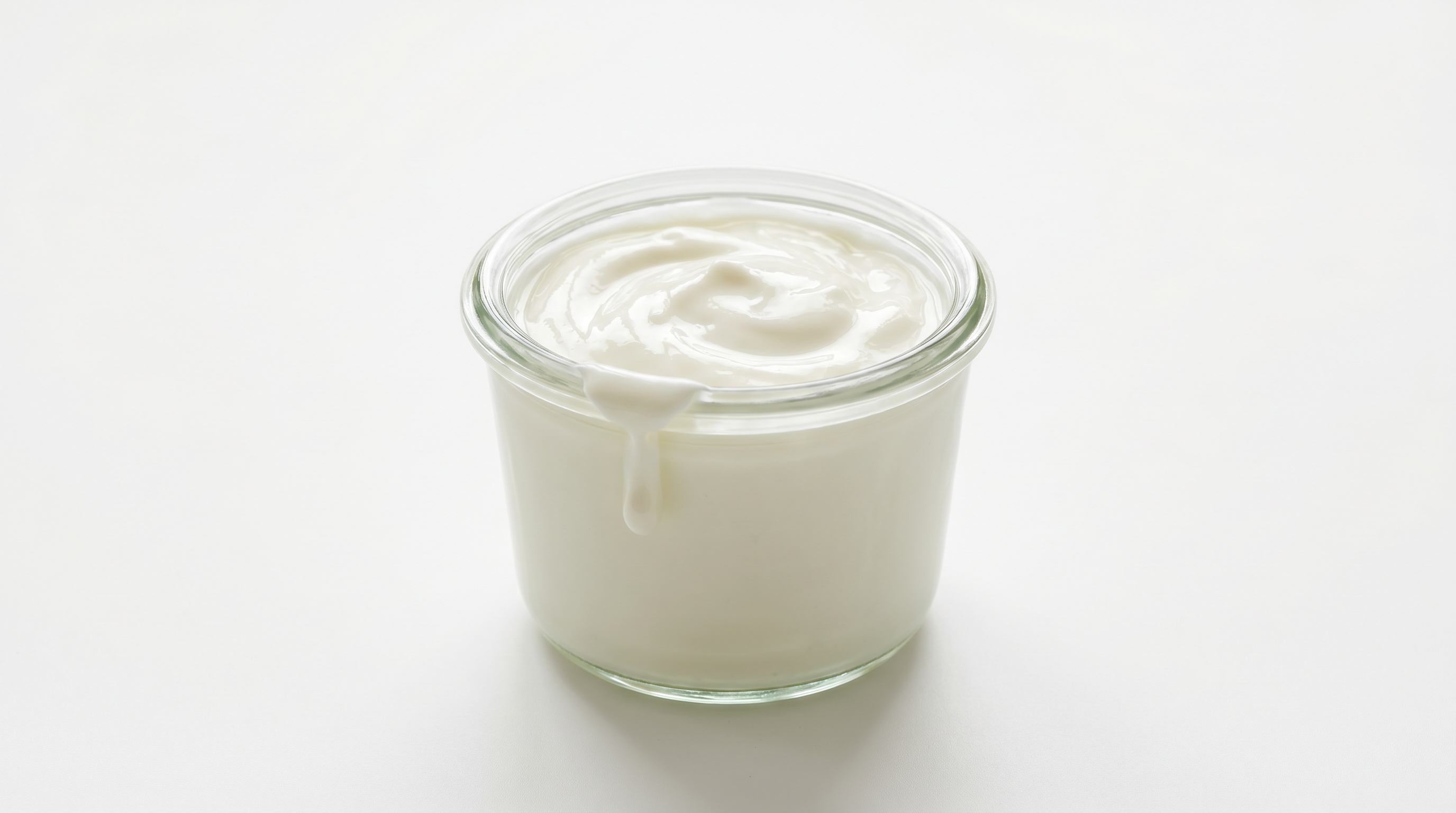 A small tasting jar of fresh yogurt, a natural source of riboflavin